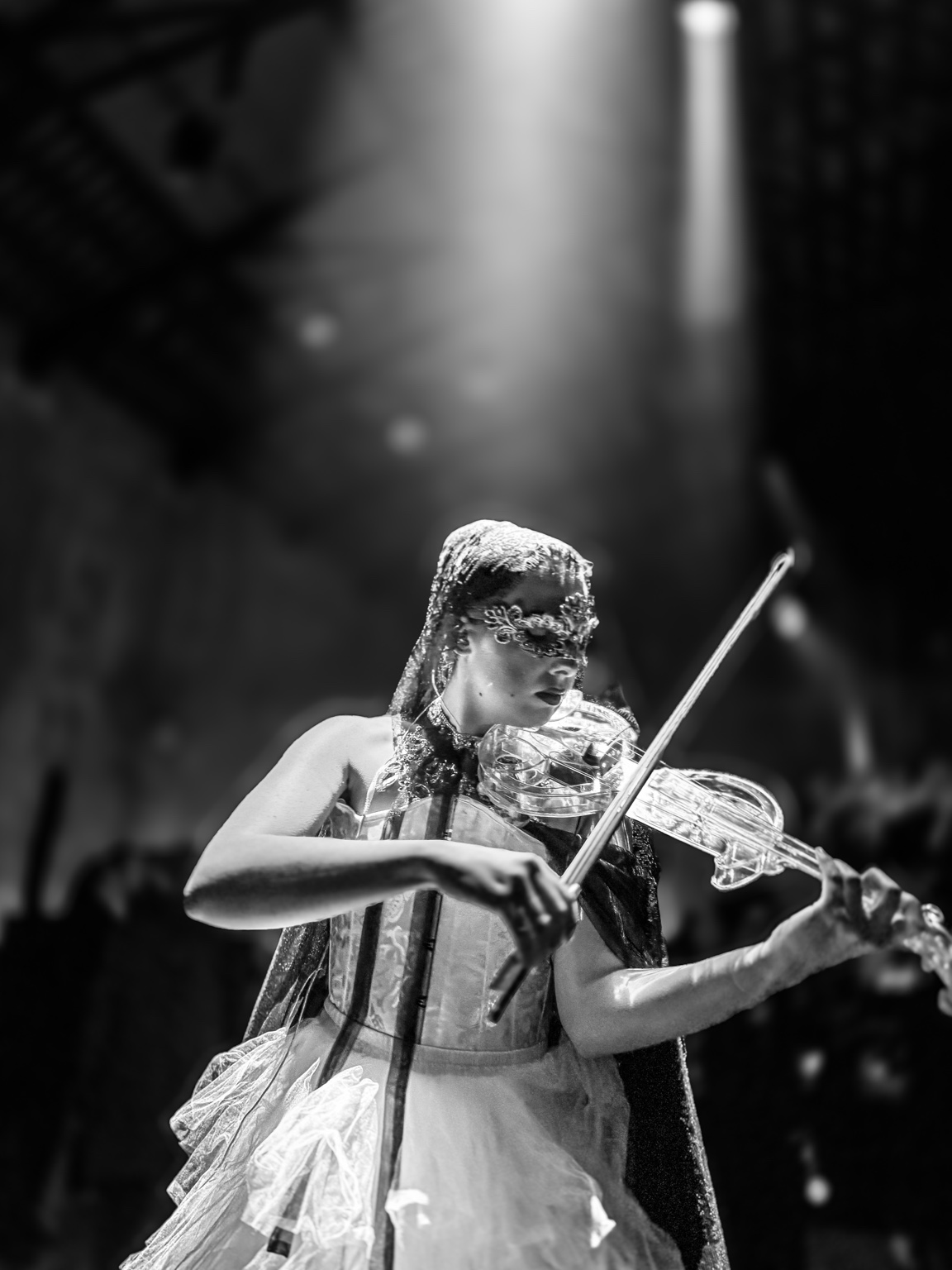 Violinist performing under stage light